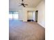 Open living room with vaulted ceilings, carpet flooring, and sliding glass doors at 1880 N Crystal Lake Dr # 28, Lakeland, FL 33801