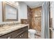 Bathroom with a modern sink, granite countertop, tile shower and shower curtain at 1957 Prairie Dunes N Cir, Lakeland, FL 33810