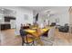 Dining area shows dining table with seating for six, tile floors, and open access to kitchen and living areas at 1957 Prairie Dunes N Cir, Lakeland, FL 33810