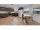 Open-concept kitchen and dining area featuring stainless appliances and plenty of counter space at 1957 Prairie Dunes N Cir, Lakeland, FL 33810