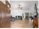 Open living room features neutral walls, tile floors, modern ceiling fan, and contemporary furniture at 1957 Prairie Dunes N Cir, Lakeland, FL 33810