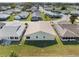 This home's rear exterior features a well maintained lawn, and a light green exterior at 1957 Prairie Dunes N Cir, Lakeland, FL 33810