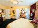 Bright bedroom with patterned bedding, vintage decor, and ample natural light at 2015 E Beacon By Way, Lakeland, FL 33803