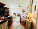 Comfortable bedroom featuring floral accents, a ceiling fan, and ample natural light from bay window at 2015 E Beacon By Way, Lakeland, FL 33803