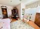 Bedroom featuring hardwood floors, pastel pink walls, and floral accents; the ideal room for relaxation and rest at 2015 E Beacon By Way, Lakeland, FL 33803