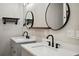 Bathroom features double vanities with modern faucets and decorative lighting at 2038 Winterset Dr # 2038, Lakeland, FL 33813