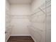 Walk-in closet with wire shelving and wood floors at 2038 Winterset Dr # 2038, Lakeland, FL 33813