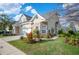 Charming home featuring stone accents, manicured lawn, and an attached two-car garage at 2038 Winterset Dr # 2038, Lakeland, FL 33813