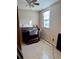 Modest bedroom with organ and natural light from the window at 209 Ann Ave, Dundee, FL 33838