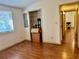 Bedroom features wood floors and closet with shelving for storage at 209 Ann Ave, Dundee, FL 33838