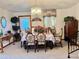 Formal dining room with table, chandelier, and vintage decor at 209 Ann Ave, Dundee, FL 33838