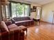 Inviting living room with hardwood floors, window and cozy furniture perfect for Gathering gatherings at 209 Ann Ave, Dundee, FL 33838