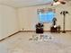 Neutral living room with carpet, window, and vintage decor at 209 Ann Ave, Dundee, FL 33838