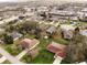 A lovely aerial view of a neighborhood with well-maintained homes and lush greenery at 2111 Groveglen S Ln, Lakeland, FL 33813