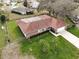 An aerial perspective showcasing this charming home with fenced yard and mature trees at 2111 Groveglen S Ln, Lakeland, FL 33813