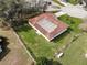 Aerial view of a well-maintained property with green lawn and mature trees at 2111 Groveglen S Ln, Lakeland, FL 33813