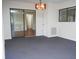 Open dining area with sliding glass doors, a chandelier, and view of an adjacent room at 2111 Groveglen S Ln, Lakeland, FL 33813