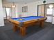 Game room featuring a pool table, carpet, and views of an adjacent living space at 2111 Groveglen S Ln, Lakeland, FL 33813