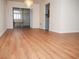 Living room featuring laminate floors, open layout, and sliding glass door to the outdoor at 2111 Groveglen S Ln, Lakeland, FL 33813