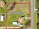 Aerial view of property highlighting the lot lines, home and sheds at 2305 State Road 33 Hwy, Clermont, FL 34714