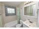 Bathroom featuring a vanity, sink, mirror and tub with shower at 2305 State Road 33 Hwy, Clermont, FL 34714