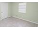 Bedroom featuring neutral walls, tile floors and a window at 2305 State Road 33 Hwy, Clermont, FL 34714