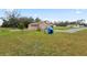 Expansive property showcasing a well-maintained lawn and various structures at 2305 State Road 33 Hwy, Clermont, FL 34714