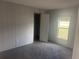 Neutral-toned bedroom with soft carpet, a window, and a closet provides comfort and functionality at 2403 Gerties Rd, Bartow, FL 33830