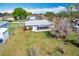 Aerial view of the backyard, showcasing the screened-in porch and landscaping at 2532 Everleth Dr, Lakeland, FL 33810