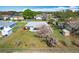 Aerial view of fenced backyard, featuring storage shed and mature trees at 2532 Everleth Dr, Lakeland, FL 33810