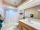 Well-lit bathroom features a shower-tub combo and vanity with sink at 2532 Everleth Dr, Lakeland, FL 33810