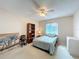 Cozy bedroom features a ceiling fan, neutral tones and a bright window at 2532 Everleth Dr, Lakeland, FL 33810