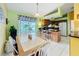 Inviting kitchen and dining area with a breakfast bar and sliding door access to the backyard at 2532 Everleth Dr, Lakeland, FL 33810