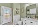 Light and airy bathroom with modern fixtures and a door to the outdoors at 2917 Blackwater Creek Dr, Lakeland, FL 33810