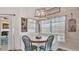 Dining nook featuring a round table with seating, natural light, and modern decor at 2917 Blackwater Creek Dr, Lakeland, FL 33810