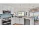 Kitchen featuring marble countertops, stainless steel appliances, and modern fixtures at 2917 Blackwater Creek Dr, Lakeland, FL 33810