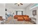 Living room area that opens into the kitchen with breakfast bar and pendant lighting at 2917 Blackwater Creek Dr, Lakeland, FL 33810