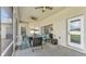 View of the cozy outdoor seating area on the screened in patio with ceiling fans at 2917 Blackwater Creek Dr, Lakeland, FL 33810