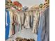 Organized walk-in closet featuring multiple shelves and rods for clothing and accessory storage at 2917 Blackwater Creek Dr, Lakeland, FL 33810