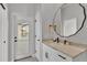 Bright bathroom with a marble countertop, modern fixtures, and access to the outdoors at 2985 Pickards Pass, Lakeland, FL 33813