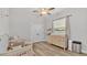 Bright Bedroom with modern floors, a ceiling fan, and a changing table by a window at 2985 Pickards Pass, Lakeland, FL 33813