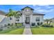 A close up of the entry to this beautiful home, featuring a stone accent entryway, and decorative landscaping at 2985 Pickards Pass, Lakeland, FL 33813