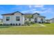 Beautiful one-story home with a well-manicured lawn, featuring a stone accent entryway, and decorative landscaping at 2985 Pickards Pass, Lakeland, FL 33813