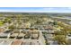 Aerial view displaying the neighborhood's layout with tree-lined streets and convenient access to commercial areas at 3203 Bear Creek Ln, Lakeland, FL 33810