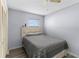 Comfortable bedroom with a ceiling fan and ample natural light from the window at 3203 Bear Creek Ln, Lakeland, FL 33810