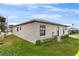 Exterior view of single-story home showing well-maintained siding and tidy landscaping at 3203 Bear Creek Ln, Lakeland, FL 33810