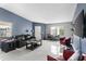 Living room with light tile, neutral paint, furniture, and lots of natural light at 3203 Bear Creek Ln, Lakeland, FL 33810