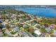 An aerial view of a home surrounded by a neighborhood near a lake, showcasing its backyard at 324 Lake Mariam Blvd, Winter Haven, FL 33884