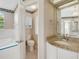 An inviting bathroom featuring a bathtub, toilet, vanity, and shower, all well-lit and spacious at 324 Lake Mariam Blvd, Winter Haven, FL 33884