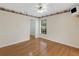 Bright bedroom featuring hardwood floors, a closet, and window at 324 Lake Mariam Blvd, Winter Haven, FL 33884